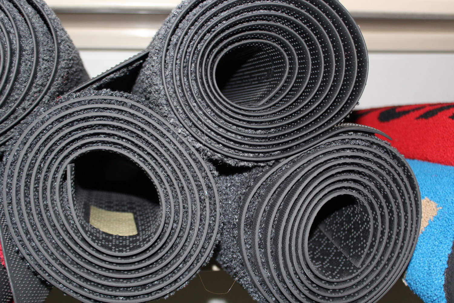 Patterns in an ordinary stack of rubber mats. Photoshoot for CompleteWorkwear, November 2012.